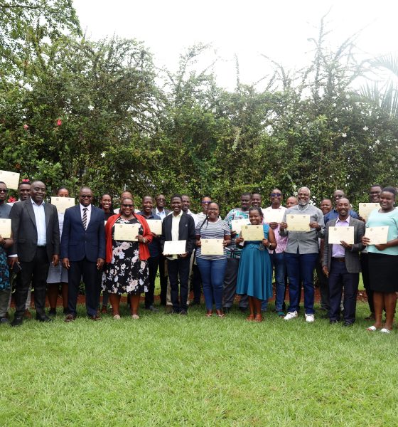 Commissioner Paul Mwanja and Assoc. Prof. Ibrahim Mike Okumu pose for a photo with participants after the certificate award ceremony on 11th July 2025. Public Investment Management (PIM) Centre of Excellence at Makerere University College of Business and Management Sciences (CoBAMS) conclusion of two-week training on the Certificate of Financial Implications (CFI) – Integrated Regulatory Cost-Benefit Analysis, for 34 economists from various MDAs with critical policy evaluation and fiscal analysis skills, 11th July 2025, Pearl on the Nile Hotel, Jinja Uganda, East Africa.