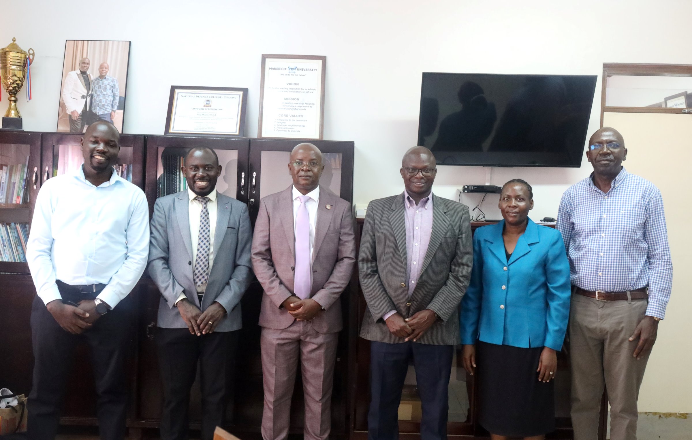 L-R: Dr. Christopher Alioni (Interim General Secretary), Dr. Peter Babyenda (Interim Chair), Prof. Edward Bbaale (Principal), Assoc. Prof. James Wokadala (Deputy Principal), Mr. Juliet Mirembe Ssewankambo (Mobilizer) and Mr. Peter Mubiru (Interim Treasurer). Prof. Edward Bbaale, the Principal of the College of Business and Management Sciences (CoBAMS) endorsed the newly-established College SACCO by enrolling as a member on 22nd July 2025, Makerere University, Kampala Uganda, East Africa.