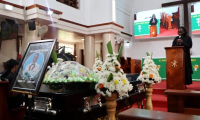 Mr. Besweri Wandera's casket in St. Francis Chapel as Rev. Scovia Kumakech leads the service. Funeral Service in honour Mr. Besweri Wandera, Assistant Lecturer, Department of Sports Science, College of Natural Sciences (CoNAS), 24th July 2025, St. Francis Chapel, Makerere University, Kampala Uganda, East Africa.