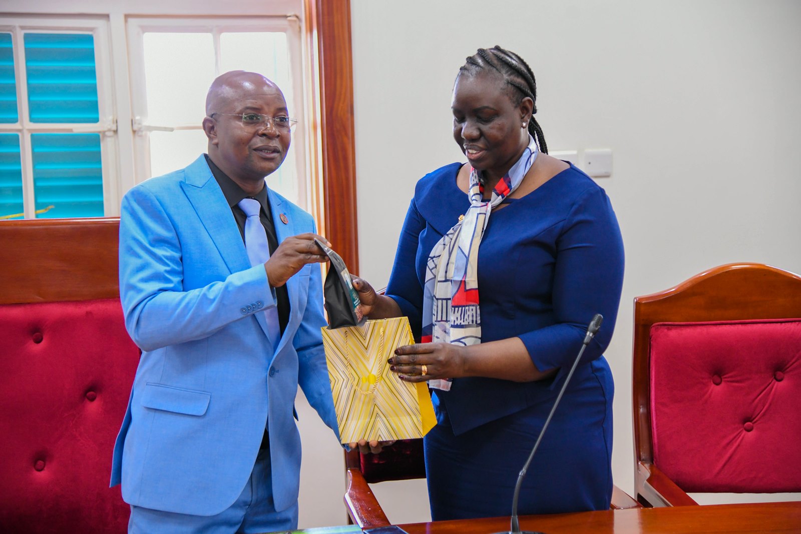 Prof. Edward Bbaale (Left) presents coffee grown, roasted and packaged by Makerere University to Dr. Victoria Anib Majur (Right) in appreciation of the delegation's visit. Chairperson and Members of the Intergovernmental Authority on Development (IGAD) Board of the Higher Education Council Courtesy Visit to Makerere University, Kampala Uganda, East Africa, Tuesday 29th July 2025.