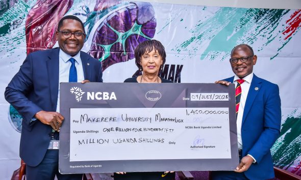 Left to Right: NCBA Bank CEO-Mr. Mark Muyobo, MakEF Board Chairperson-Dr. Maggie Kigozi and the Vice Chancellor-Prof. Barnabas Nawangwe hold the dummy cheque unveiling the UGX 1.45 billion sponsorship for the Makerere Marathon for the next five years. Makerere University Endowment Fund (MakEF)’s flagship initiative – the Makerere University Marathon unveiling of NCBA Bank Uganda as Platinum Sponsor with UGX 1.45 Billion over five years, 9th July 2025, Kampala, East Africa.