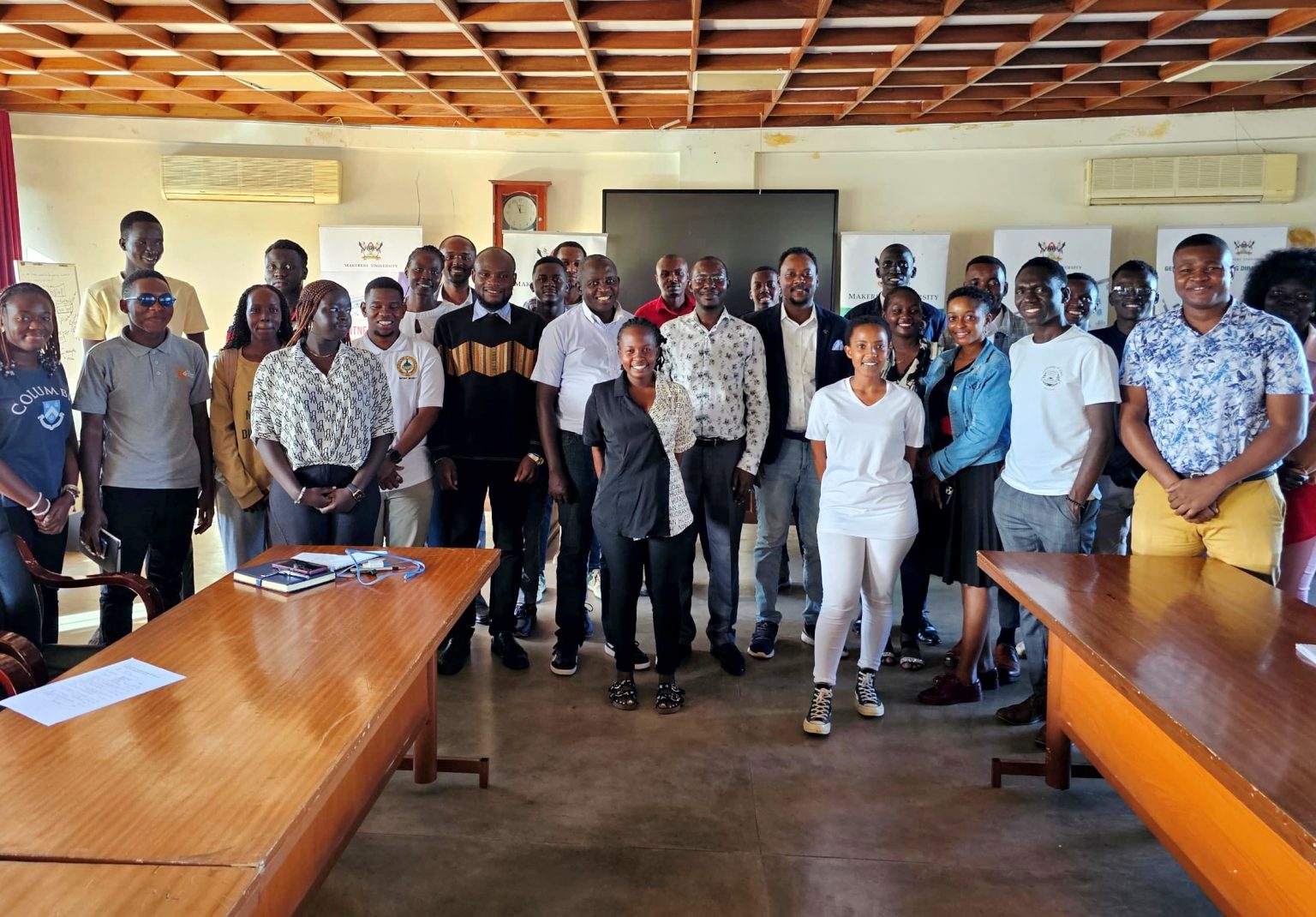 Mr. Henry Nsubuga, Mr. Peter Mwanja, Dr. Gardner Herbert and other officials pose with International Students at a Mental Health Awareness Drive