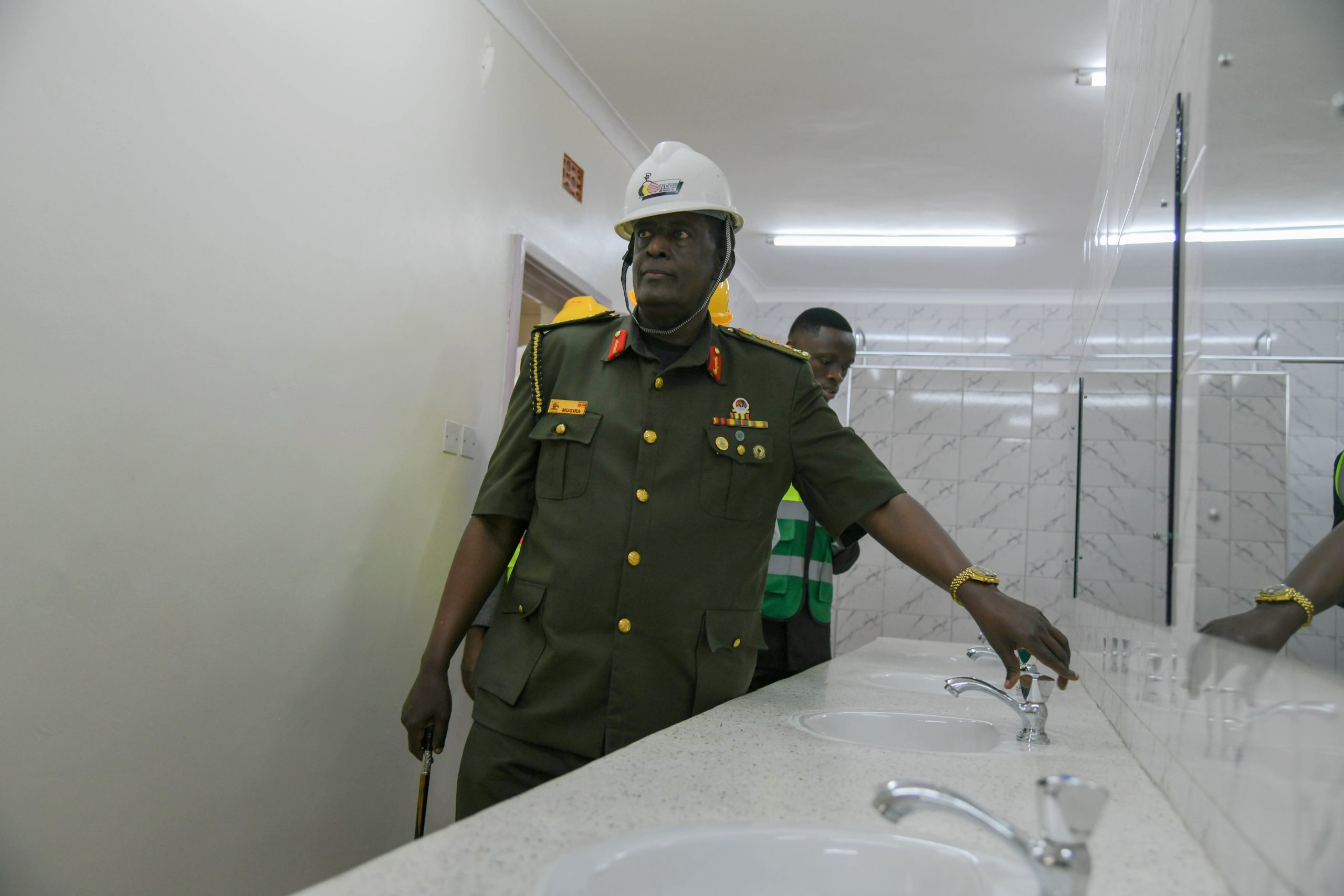 Lt. Gen. James Mugira and H.E. Ssentamu Churchill James (Rear) inspect of one of the bathroom facilities. The National Enterprise Corporation (NEC) hands over fully refurbished Mary Stuart Hall. The renovation, which cost UGX 10.5 billion, began on 26th July 2024 and was completed exactly a year later, on 25th July 2025. Makerere University, Kampala Uganda, East Africa.