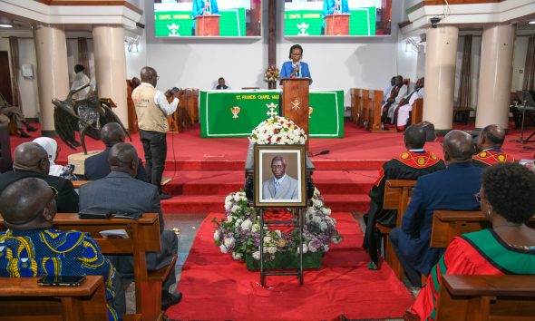 The Chairperson of Council, Mrs. Lorna Magara reads her condolence message as Professor Livingstone Sserwadda Luboobi's casket lies in St. Francis Chapel on 18th July 2025. Funeral service in honour of Professor Livingstone Sserwadda Luboobi, 18th July 2025, St. Francis Chapel, Makerere University, Kampala Uganda, East Africa.