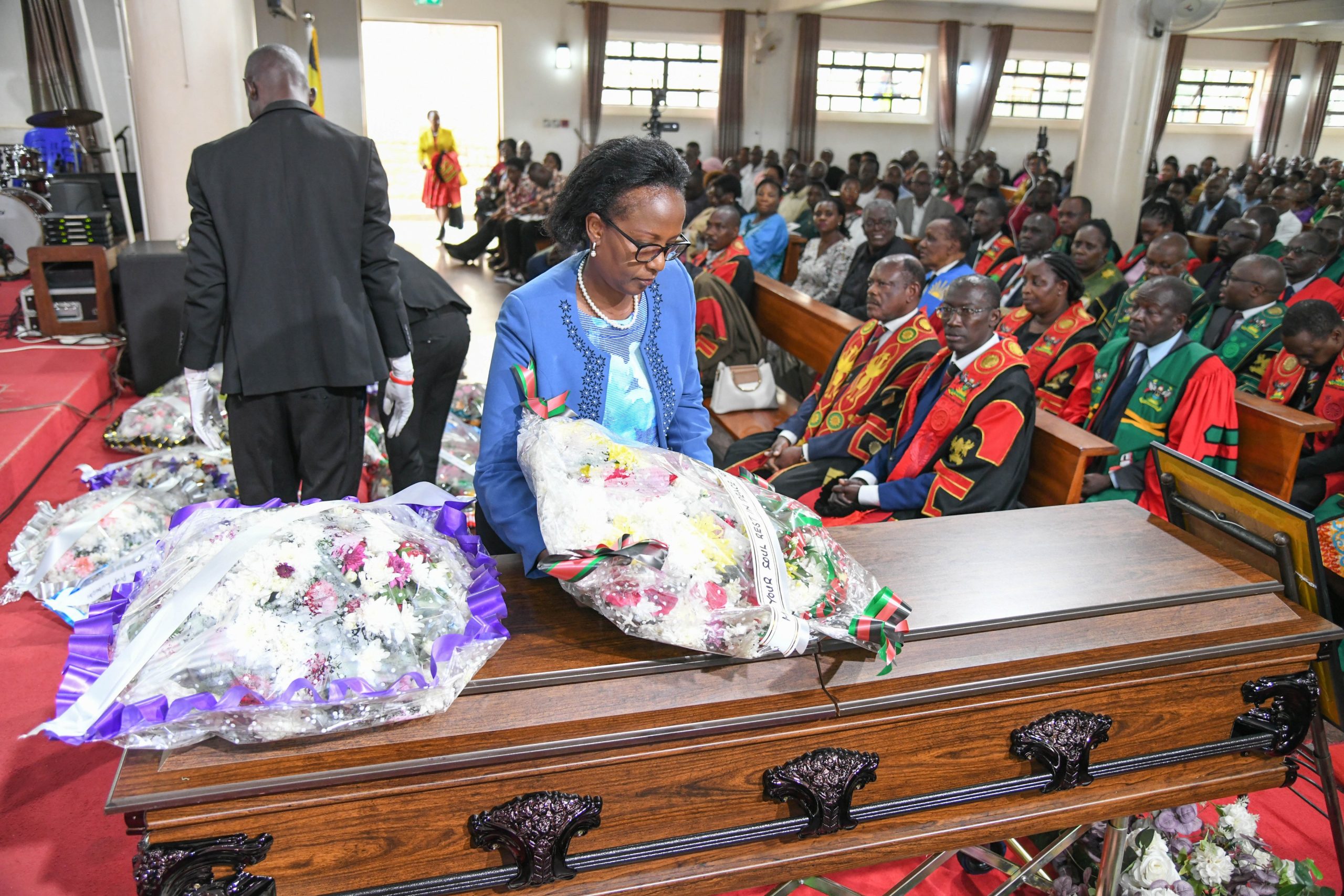Mrs. Lorna Magara pays her respects to Prof. Luboobi. Funeral service in honour of Professor Livingstone Sserwadda Luboobi, 18th July 2025, St. Francis Chapel, Makerere University, Kampala Uganda, East Africa.