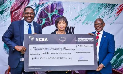 Left to Right: NCBA Bank CEO-Mr. Mark Muyobo, MakEF Board Chairperson-Dr. Maggie Kigozi and the Vice Chancellor-Prof. Barnabas Nawangwe hold the dummy cheque unveiling the UGX 1.45 billion sponsorship for the Makerere Marathon for the next five years
