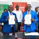 Prof. Barnabas Nawangwe, the Vice Chancellor and Mr. Saul Seremba, the Executive Director of the Insurance Training College show off the signed MoU