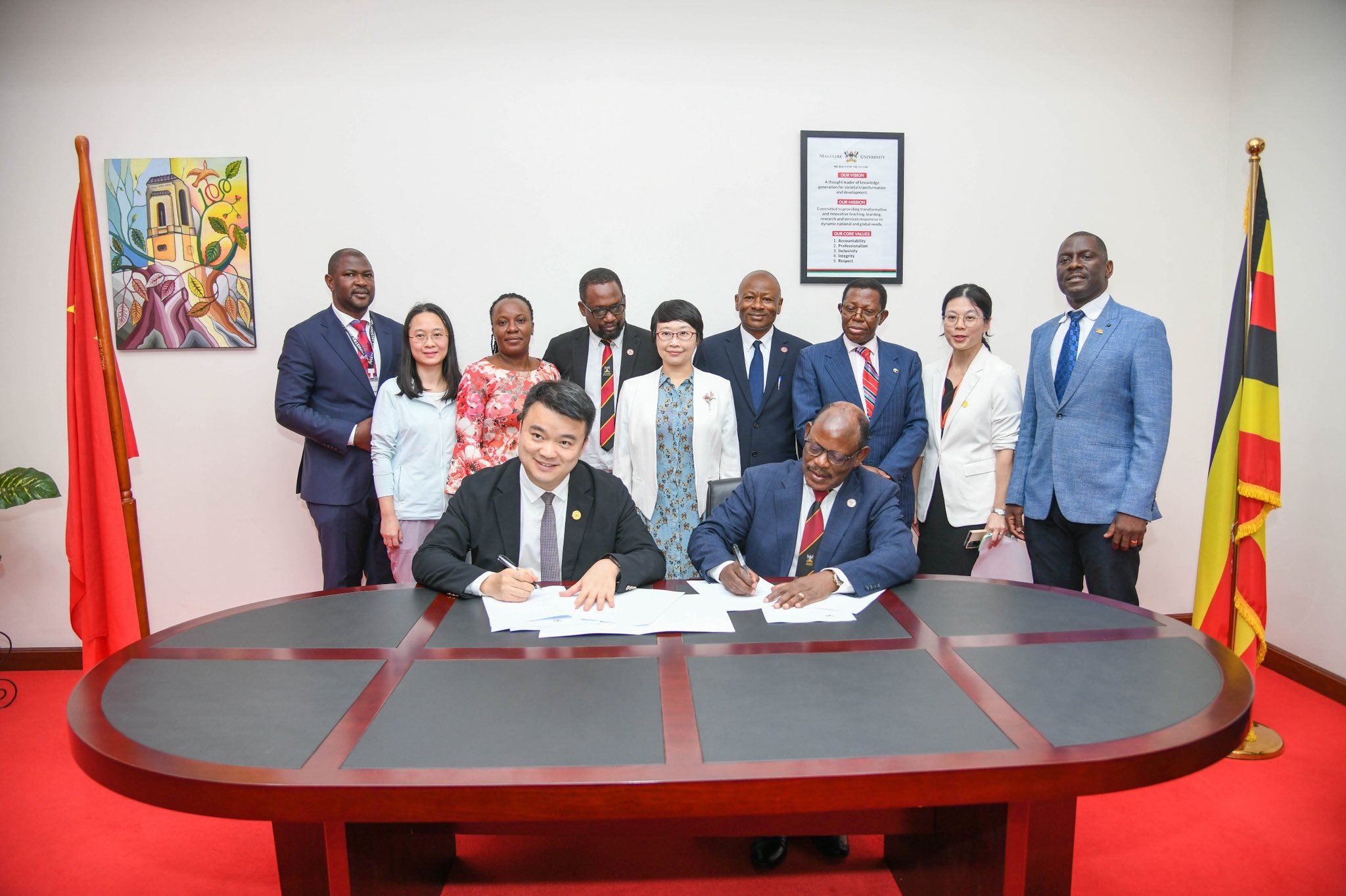Vice Chancellor, Prof. Barnabas Nawangwe and President of Zhongshan Ophthalmic Center signing Memorandum of Understanding as other officials witness