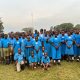 Vice Chancellor, Prof. Barnabas Nawangwe poses with Primary Seven candidates and their teachers at Busia Integrated Primary School.