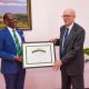The Vice Chancellor, Prof. Barnabas Nawangwe handing over the Certificate of Appreciation to Ambassador Mauro Massoni of Italy