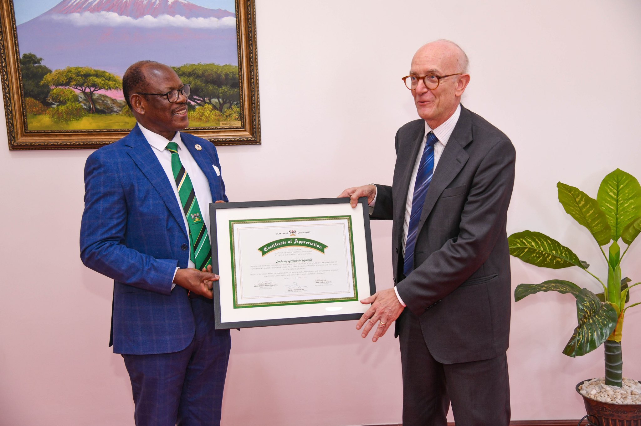 The Vice Chancellor, Prof. Barnabas Nawangwe handing over the Certificate of Appreciation to Ambassador Mauro Massoni of Italy