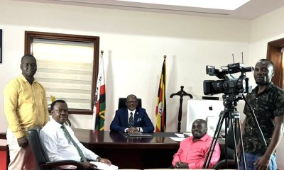 The Vice Chancellor, Prof. Barnabas Nawangwe (center) chats with the Makerere University Institute for Online Distance and e-Learning (IODeL) Multimedia team