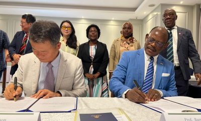 Prof. Barnabas Nawangwe and Dr. JinGo Shon sign the Memorandum of Understanding as other officials witness