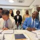 Prof. Barnabas Nawangwe and Dr. JinGo Shon sign the Memorandum of Understanding as other officials witness
