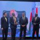 The Vice Chancellor, Prof. Barnabas Nawangwe (2ND L) receiving his award along side other officials.