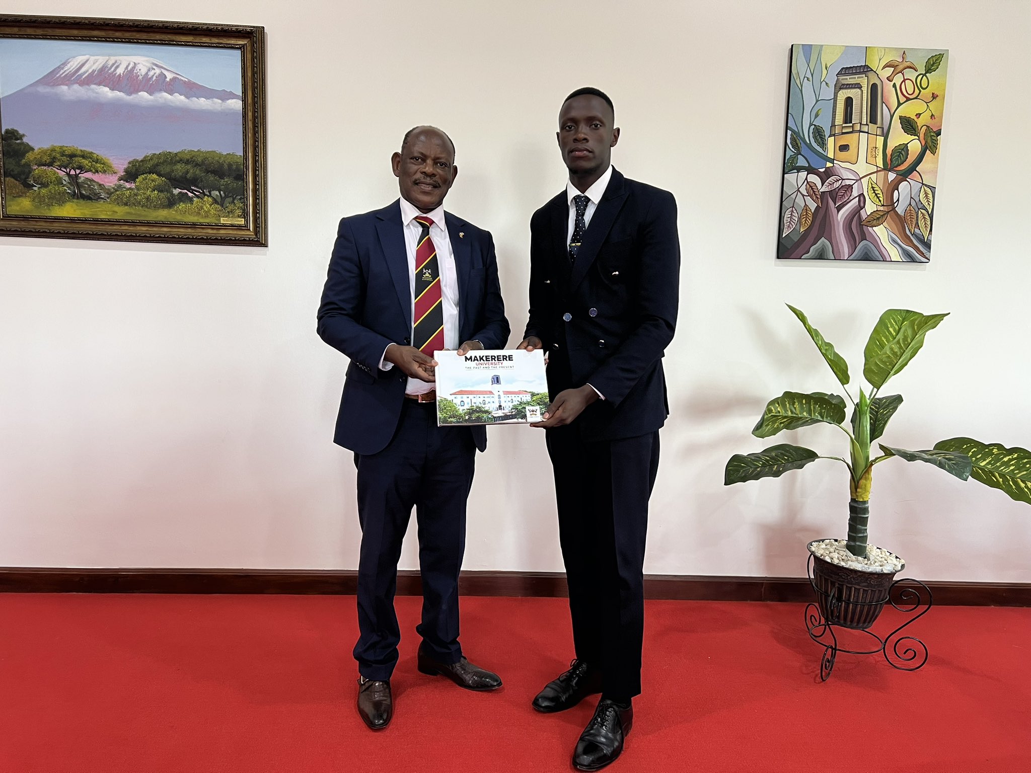 The Vice Chancellor, Prof. Barnabas Nawangwe (L) with Mr. Churchill (R) at Makerere University.