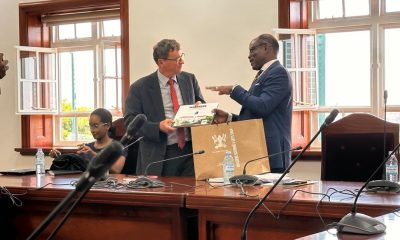 Prof. Barnabas Nawangwe (Right) handing over a gift to Mr. Laurent Bochereau meeting with Makerere University Top Management.