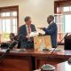 Prof. Barnabas Nawangwe (Right) handing over a gift to Mr. Laurent Bochereau meeting with Makerere University Top Management.