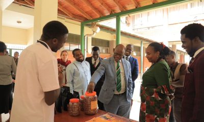 The Vice Chancellor, Prof. Barnabas Nawangwe (C) inspecting some of the sample work done at the Centre while at the lunch.
