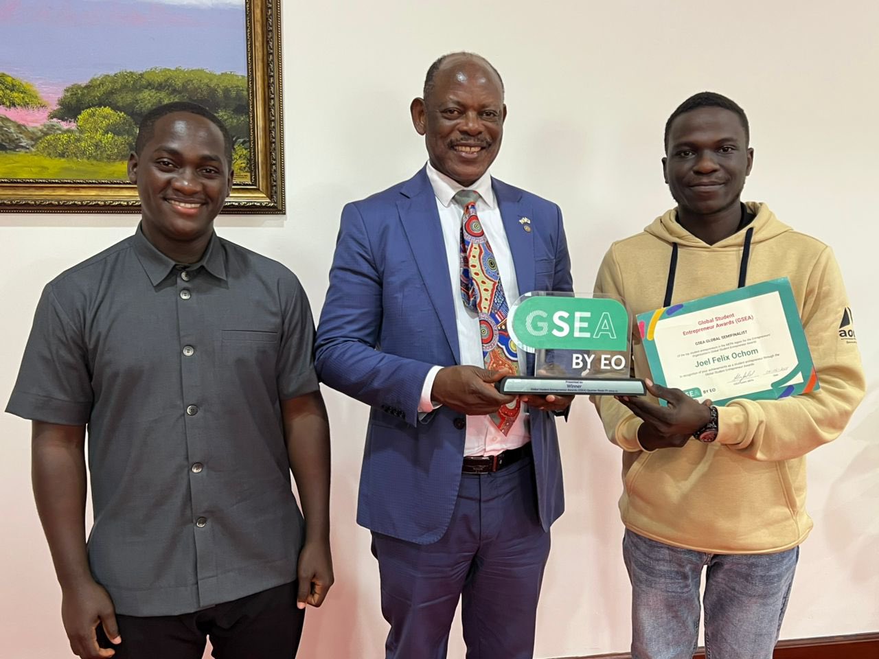 Prof. Barnabas Nawangwe (Center) with H.E. Vincent Lubega Nsamba (Left) and Ochom Felix (Right) pose as they show off the award