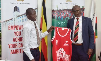 The Vice Chancellor, Prof. Barnabas Nawangwe (R) receiving his kit at Makerere University.