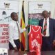 The Vice Chancellor, Prof. Barnabas Nawangwe (R) receiving his kit at Makerere University.