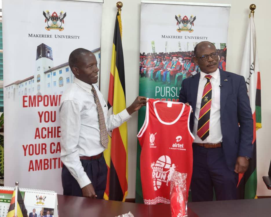 The Vice Chancellor, Prof. Barnabas Nawangwe (R) receiving his kit at Makerere University.