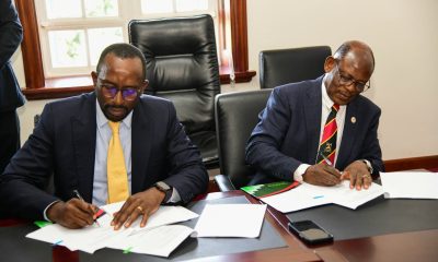 The Vice Chancellor, Prof. Barnabas Nawangwe (R) and the Chairman of NCS, Mr. Ambrose Tashobya (L) during the signing ceremony at Makerere University.