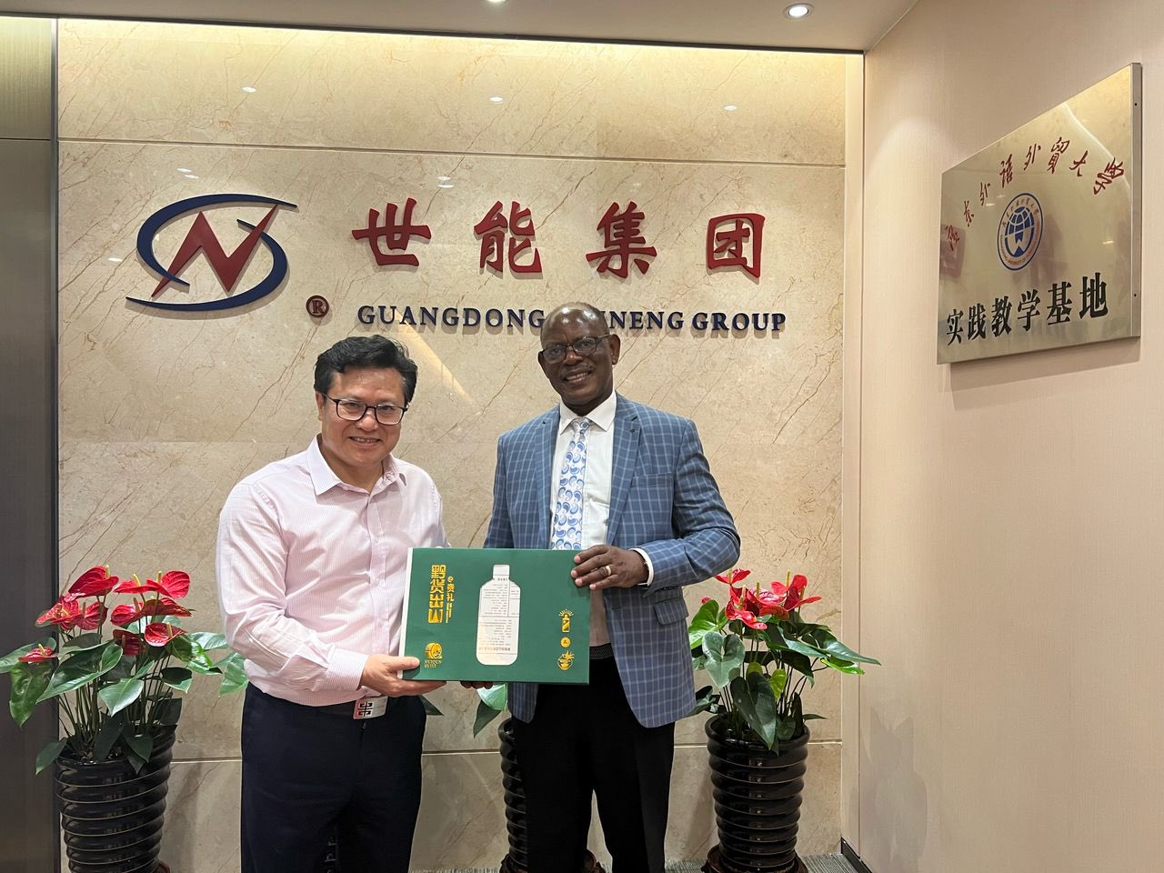 The Vice Chancellor, Prof. Barnabas Nawangwe (R) along side another official in China.