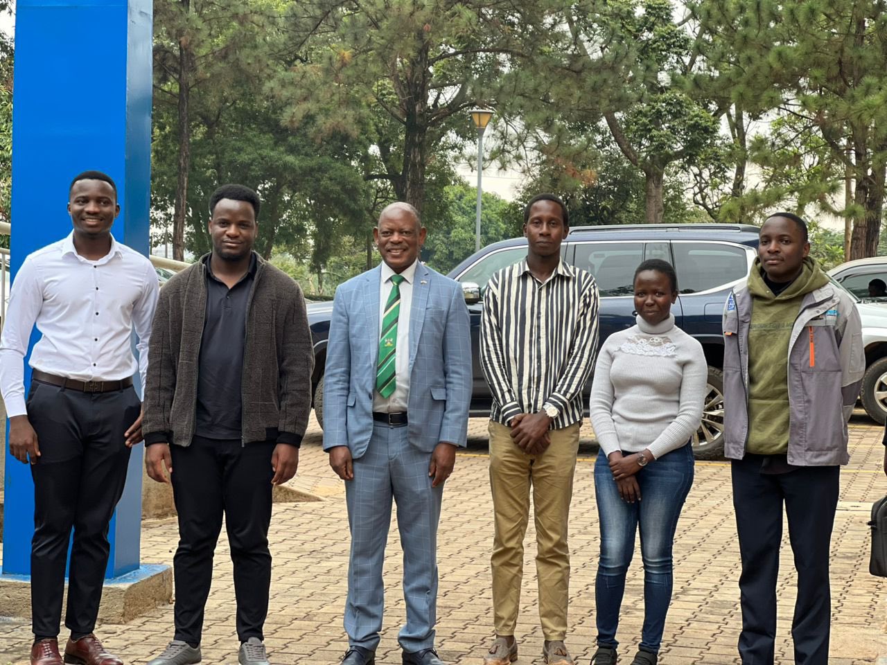 The Vice Chancellor, Prof. Barnabas Nawangwe (3RD L) together with the group of young people at the UnIPod.