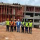 The Vice Chancellor, Prof. Barnabas Nawangwe (C) and the interning Makerere engineering students.