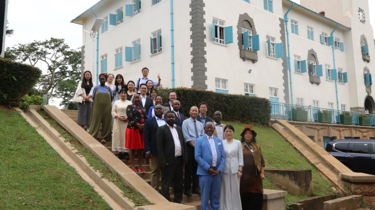 Front line: The Vice Chancellor, Prof. Barnabas Nawangwe (L) with the Vice Chairperson of the University Council, Madam Zhu (C) along side other officials.
