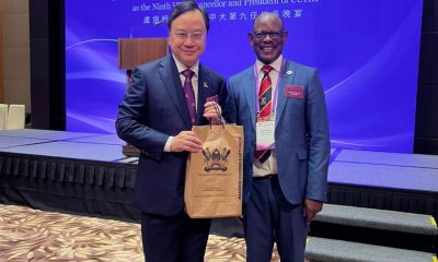 The Vice Chancellor, Prof. Barnabas Nawangwe (R) and Prof. Dennis Lo Yuk-ming (L) with his congratulatory gift.