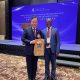 The Vice Chancellor, Prof. Barnabas Nawangwe (R) and Prof. Dennis Lo Yuk-ming (L) with his congratulatory gift.