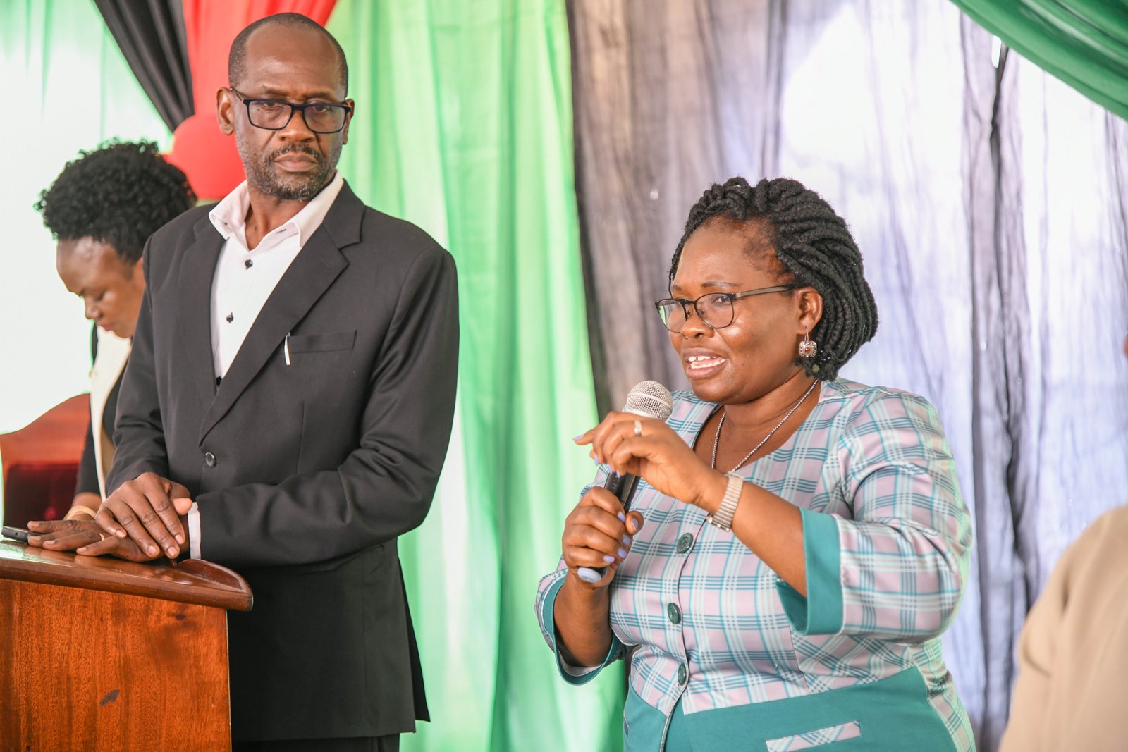 Dr. Eve Nabulya (Right) and Mr. Moses Oluka prepare to lead one of the prayer sessions. 2nd Prayer Breakfast, Theme: “Integrating Faith, Learning and Service”, Speaker: Rev. Canon Dr. John Senyonyi, 1st August 2025, St. Francis Chapel Gardens, Makerere University, Kampala Uganda, East Africa.