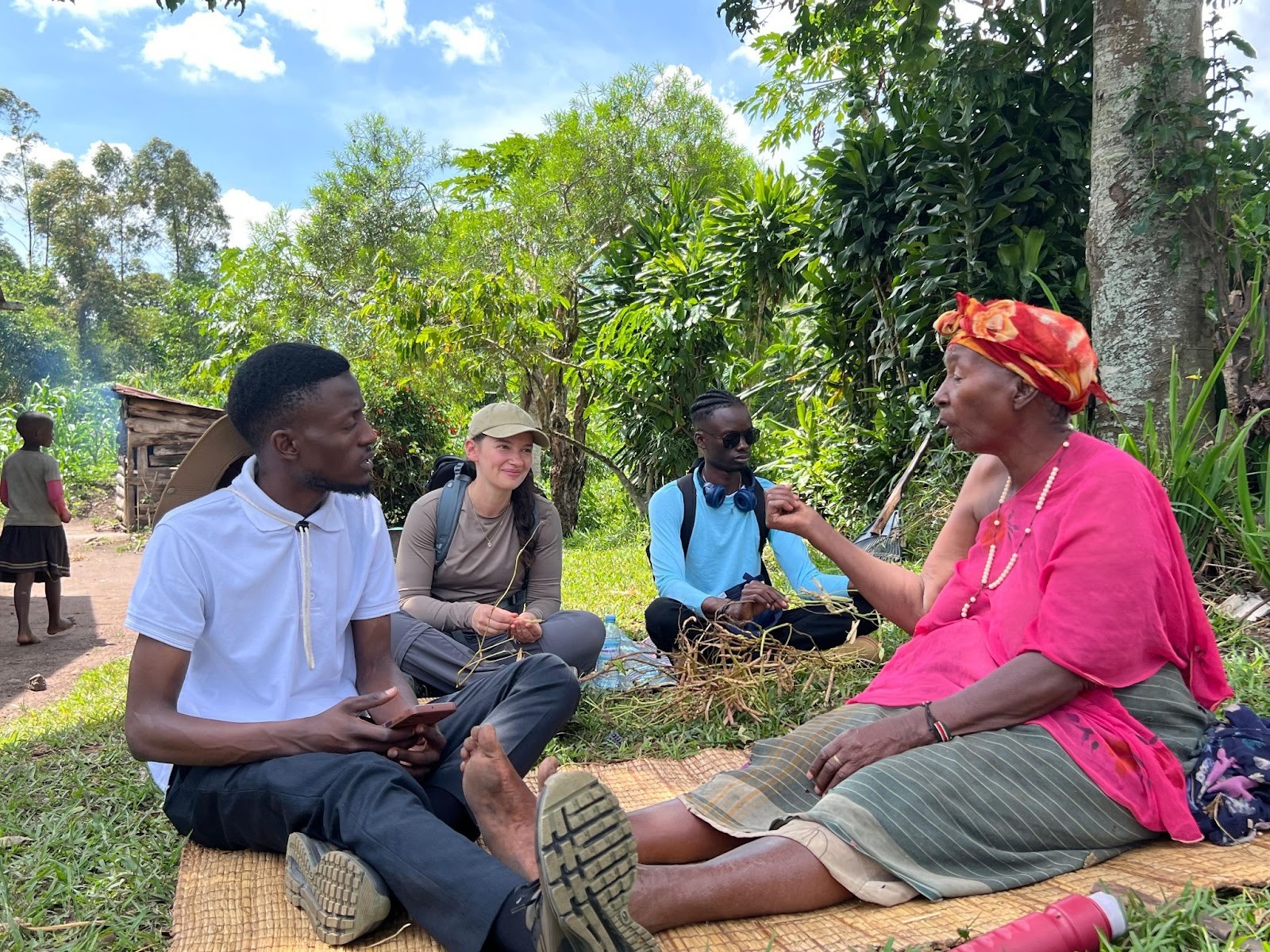 Students from Rhein-Waal University of Applied Sciences interacting with the elderly about the impacts of forests towards the community. DAAD-funded project course conducted under the collaborative partnership between Makerere University, Kampala Uganda, East Africa and Rhein-Waal University of Applied Sciences (Germany), emphasizing sustainability, conservation, and community engagement, annual field course, 26th May to 3rd June 2025, Makerere University Biological Field Station (MUBFS), Kibale National Park.