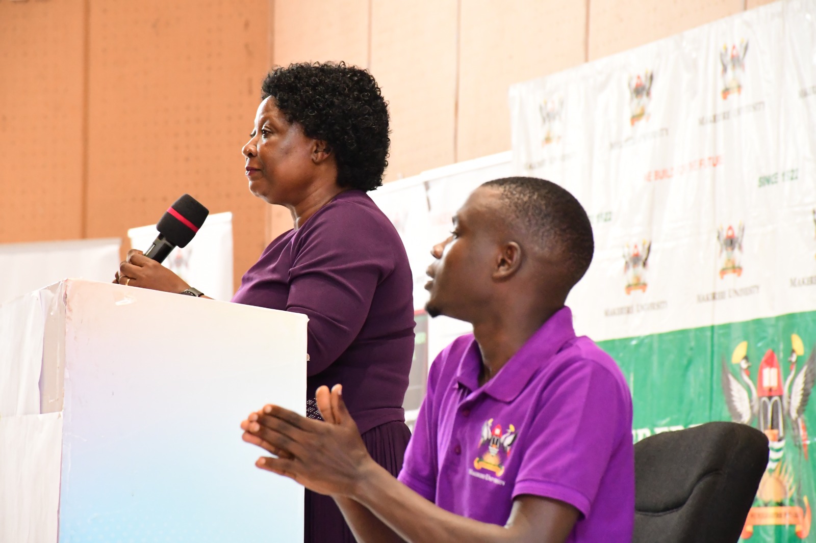 Dr. Harriet Nabushawo and Mr. Oscar Kizito, the Sign Language Interpreter. College of Education and External Studies (CEES) orientation ceremony to acquaint new students with College structures, academic programmes, services, and, its contribution to the University’s core functions, 6th August 2025, Yusuf Lule Central Teaching Facility Auditorium, Makerere University, Kampala Uganda, East Africa.
