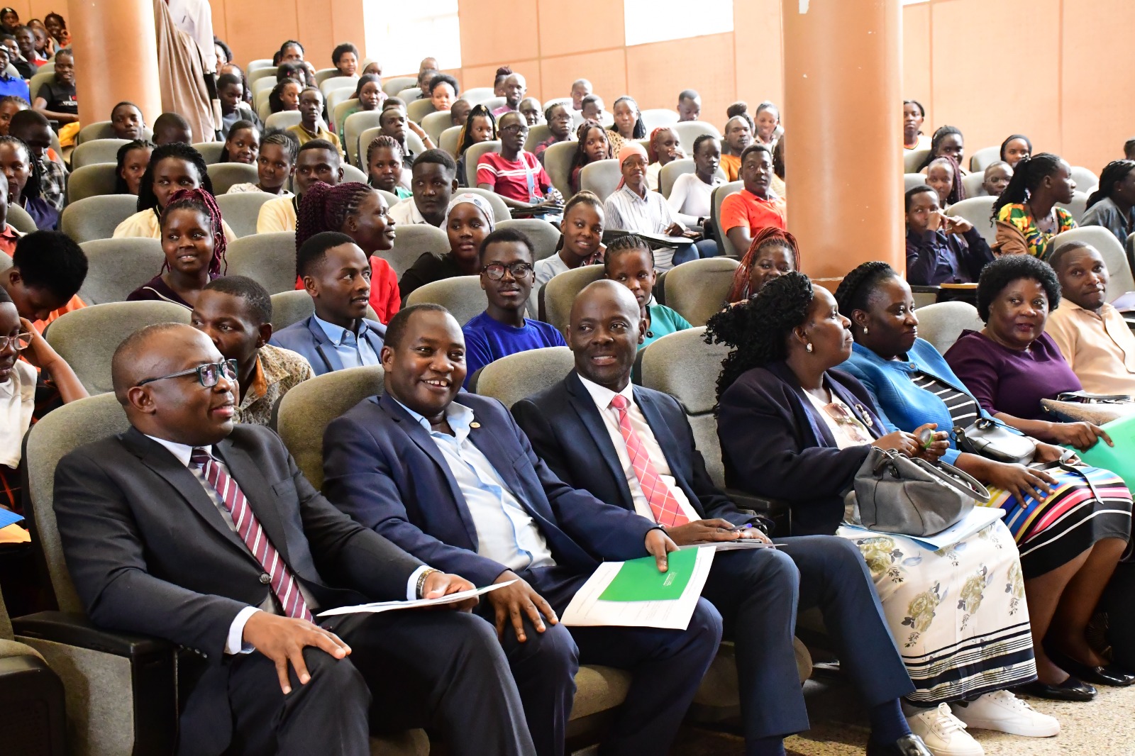 L-R: Prof. Ronald Bisaso, Dr. Michael Walimbwa, Associate Prof. Mathias Mulumba Bwanika, Mrs. Joanna Kayaga Kiwana, Ms. Rosemary Nalwanga, and Dr. Harriet Nabushawo with some of the officials and students who formed the audience. College of Education and External Studies (CEES) orientation ceremony to acquaint new students with College structures, academic programmes, services, and, its contribution to the University’s core functions, 6th August 2025, Yusuf Lule Central Teaching Facility Auditorium, Makerere University, Kampala Uganda, East Africa.