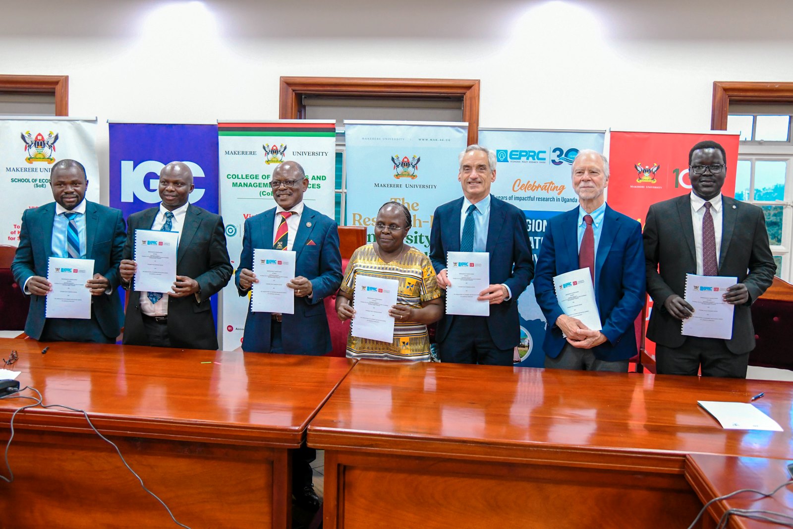 The partners show off the signed MoU. Makerere University, through the College of Business and Management Sciences (CoBAMS) and the Economic Policy Research Centre (EPRC), has signed an open Memorandum of Understanding (MoU) with the London School of Economics and Political Science (LSE), 27th August 2025, Kampala Uganda, East Africa.