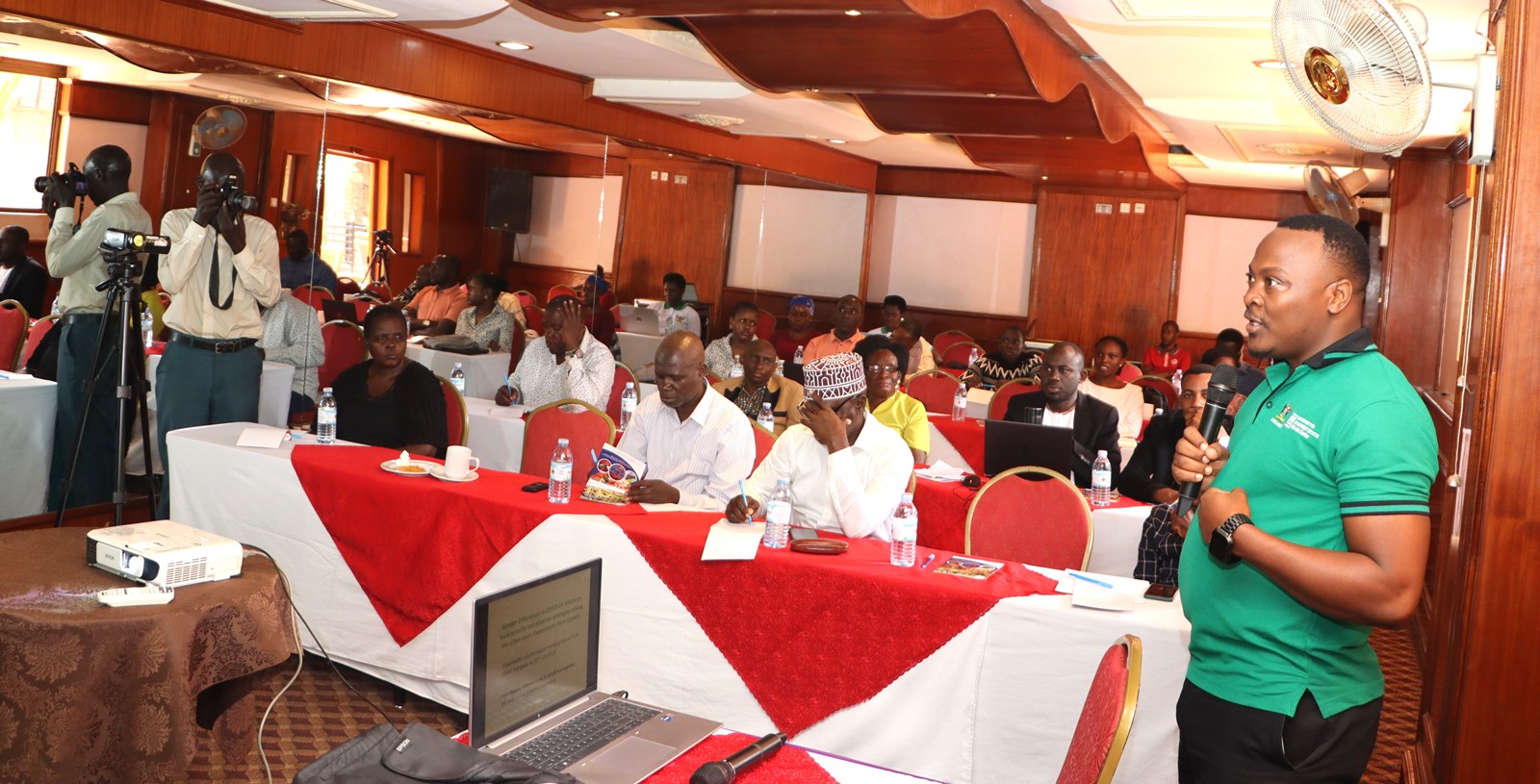 Fred Kasalirwe presenting the research findings at Tick Hotel in Kawempe. Dissemination by EfD-Mak Centre at Makerere University of study “Differences in COVID-19 Effects on Food Security and Adaptive Strategies among the Urban Poor: Experiences from Uganda and Tanzania”, conducted between 2022 and 2023 in collaboration with EfD Tanzania, Tick Hotel Kawempe Division, Kampala Uganda, East Africa.
