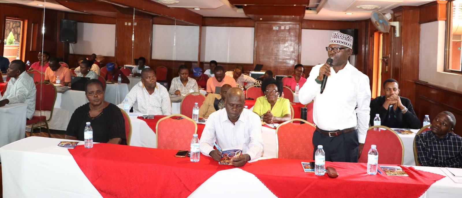 A participant contributes during the discussion. Dissemination by EfD-Mak Centre at Makerere University of study “Differences in COVID-19 Effects on Food Security and Adaptive Strategies among the Urban Poor: Experiences from Uganda and Tanzania”, conducted between 2022 and 2023 in collaboration with EfD Tanzania, Tick Hotel Kawempe Division, Kampala Uganda, East Africa.