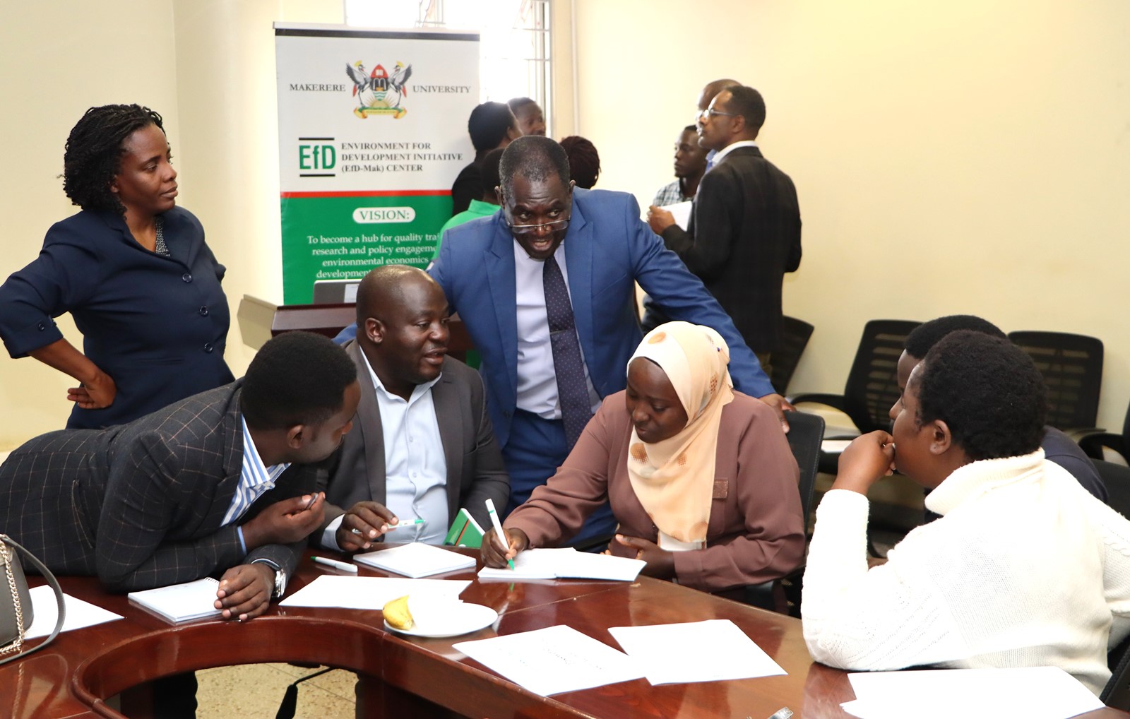 Participants in a group discussion. Two-day high-level training for 40 Ugandan government officials on biodiversity conservation, community-based natural resource management, and economic valuation of national parks Organized by EfD Uganda, 20th-21st August 2025, Makerere University, Kampala Uganda, East Africa.