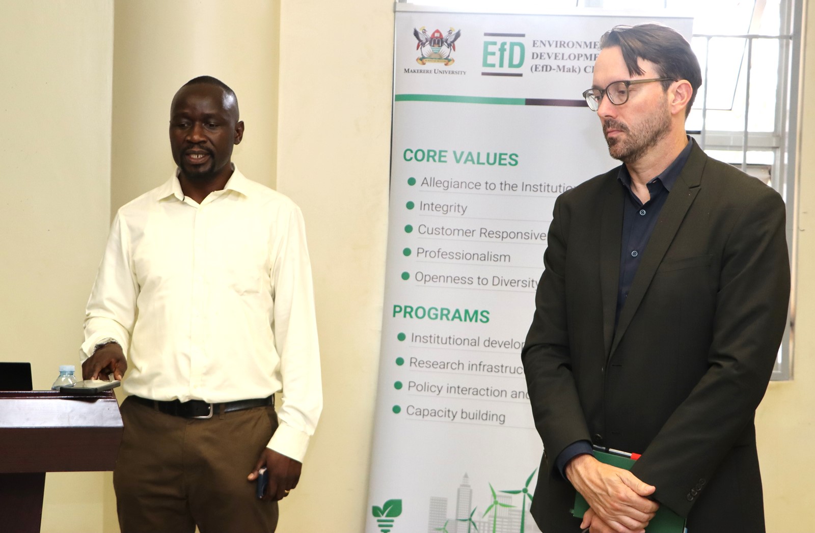 Byakagaba welcomes Purdon to present. Prof. Mark Purdon seminar and launch of his new book "The Political Economy of Climate Finance Effectiveness in Developing Countries: Carbon Markets, Climate Funds, and the State" hosted by the Environment for Development (EfD) Makerere Centre, 27th August 2025, Yusuf Lule Central Teaching Facility, Makerere University, Kampala Uganda, East Africa.