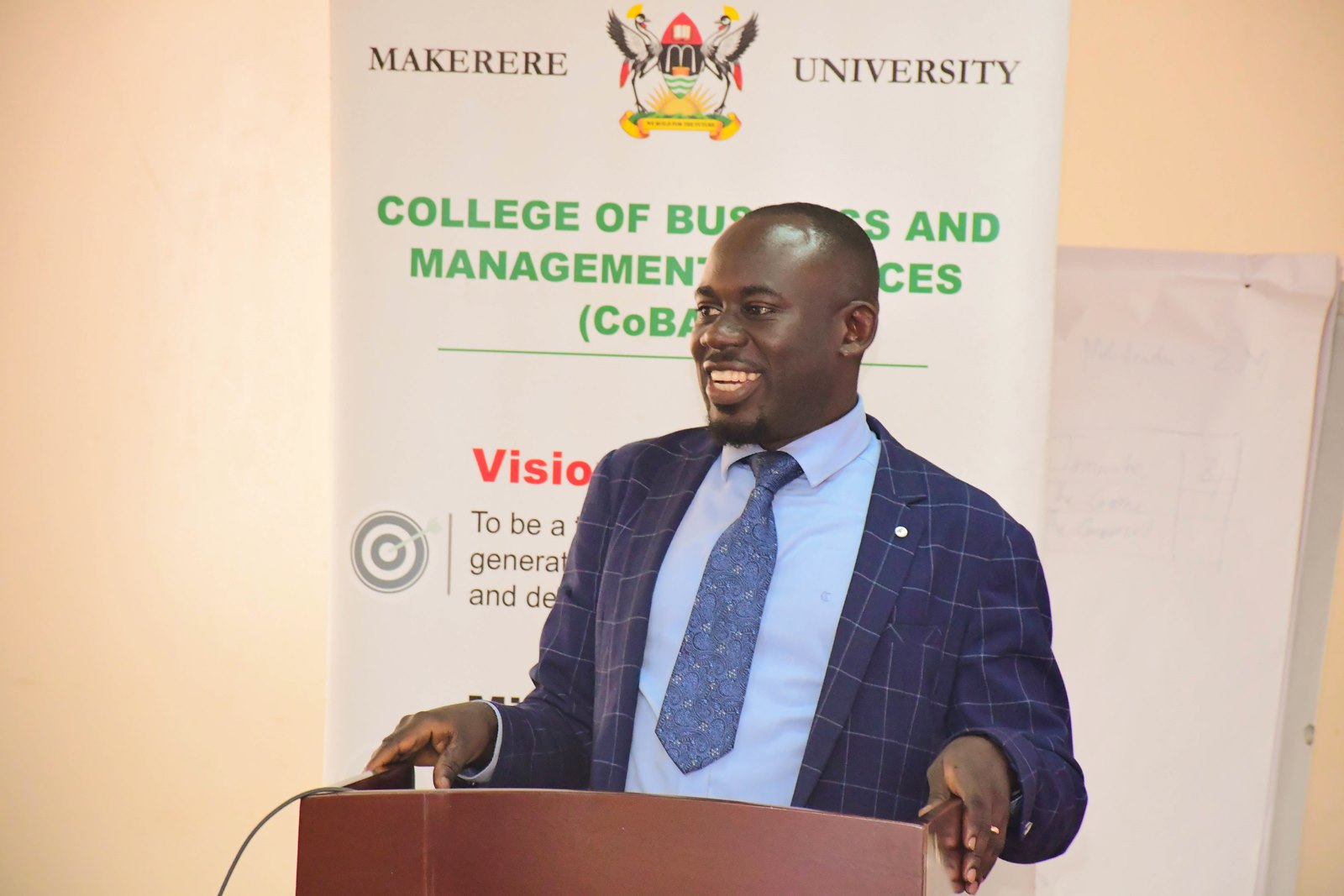 Dr. Peter Babyenda. Presentation: “Africa’s Growth Trends and Prospects in Light of Evolving Global Challenges” by Dr. Paul Mpuga, a visiting Scholar and Division Manager for Microeconomic Policy, Debt Sustainability, and Forecasting in the Economic Governance and Knowledge Management Vice-Presidency of the African Development Bank Group, 19th August 2025, Conference Room, Level 2, Block B, College of Business and Management Sciences (CoBAMS), Makerere University, Kampala Uganda, East Africa.