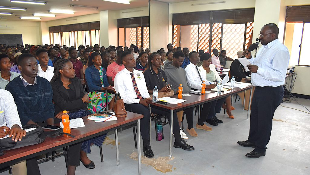 Dr Joel Isanga briefing students about the Department of Biochemistry and Systems Biology. College of Natural Sciences (CoNAS) orientation ceremony to acquaint new students with College structures, academic programmes, services, and, its contribution to the University’s core functions, 6th August 2025, JICA Building, Makerere University, Kampala Uganda, East Africa.