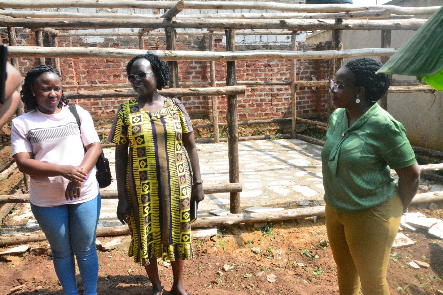 The team interacts with Mrs. Mugisha (R). In the background is the slab where the manure will be dried before further processing and packaging. Regional research initiative “Building Capacity for Innovation and Advancement of Climate Smart Agriculture in East and Southern Africa” (CICSA-E&SA) visited to Mr. Mugisha Jonan, urban farmer and environmentalist in Sentema Wakiso District, adoption of innovative practices redefining the feasibility of farming in densely populated urban settings through the Nutrient Recycling Innovation, CoVAB, Makerere University, Kampala Uganda.