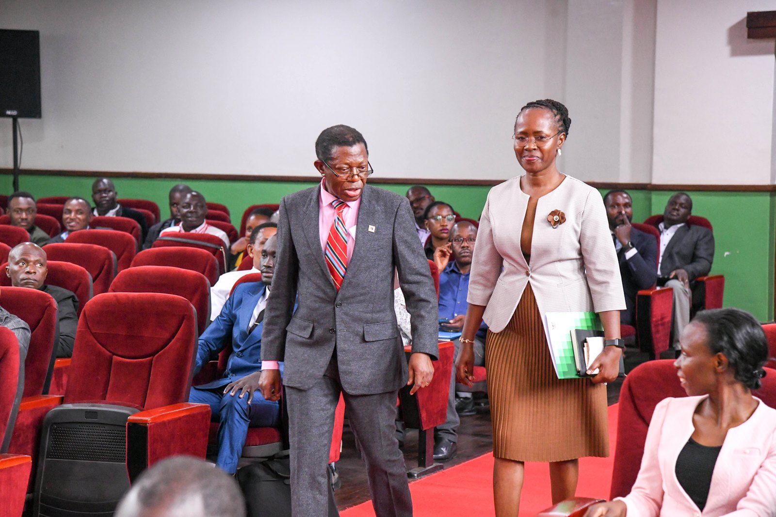 Prof. Buyinza Mukadasi leads Prof. Sarah Ssali into the venue. Public presentation by Prof. Sarah Ssali, candidate vying for the position of First Deputy Vice Chancellor (DVC) for Academic Affairs, under the theme “Strengthening the Teaching–Research Nexus to Deliver High-Quality Graduates for Africa’s Transformation”, 25th August 2025, Main Hall, Main Building, Makerere University, Kampala Uganda, East Africa.
