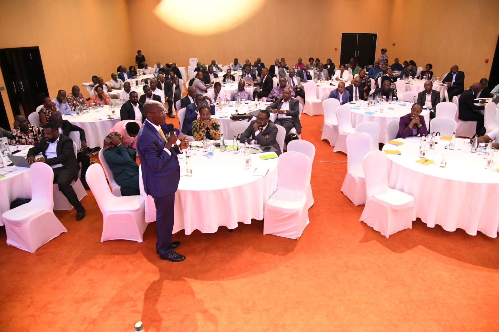 Prof. Frank Norbert Mwiine (Standing) contributes during one of the plenary sessions. Top Management Capacity Building Training for Makerere University aimed at building excellence in 21st Century University Leadership at Makerere through two objectives namely; Strategic Budget Mastery and Implementation Excellence, and Comprehensive Management Excellence and Skills Enhancement on 14th August 2025, Speke Resort Munyonyo, Kampala Uganda, East Africa.