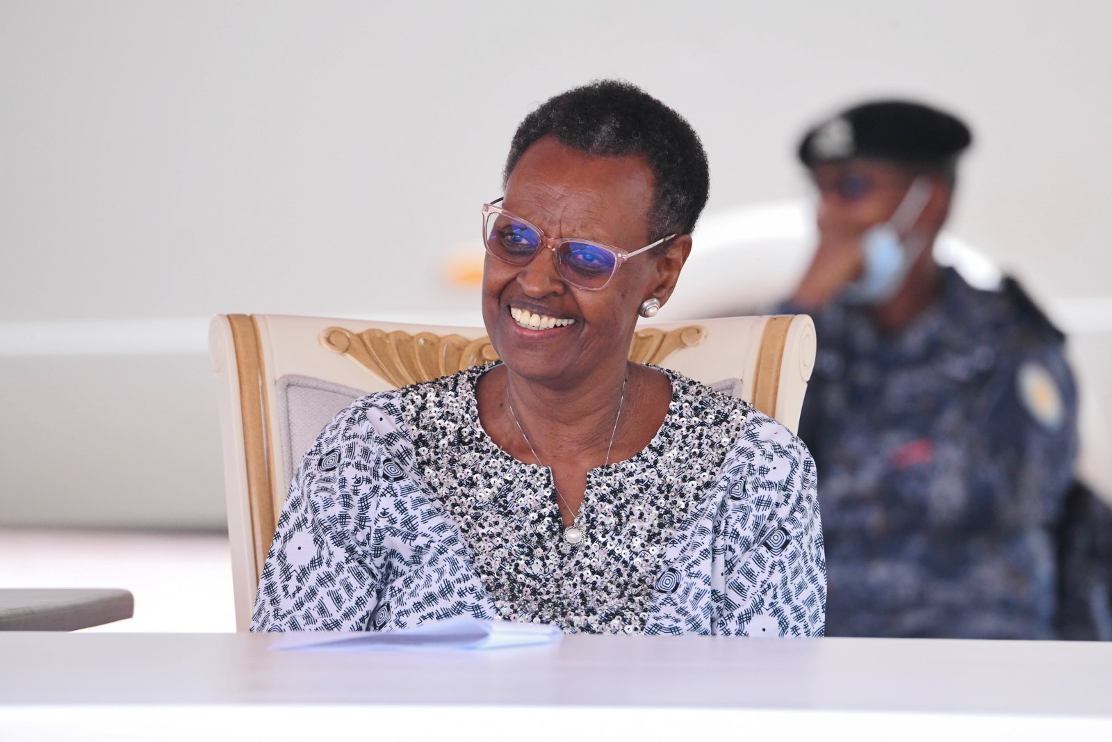 Hon. Janet Kataaha Museveni beams as she listens to some of the speeches. First Lady and Minister of Education and Sports, Hon. Janet Kataaha Museveni officially reopened Mary Stuart Hall after a year-long renovation project that cost UGX 10.5 billion, by the National Enterprise Corporation (NEC), August 15, 2025, Makerere University, Kampala Uganda, East Africa.