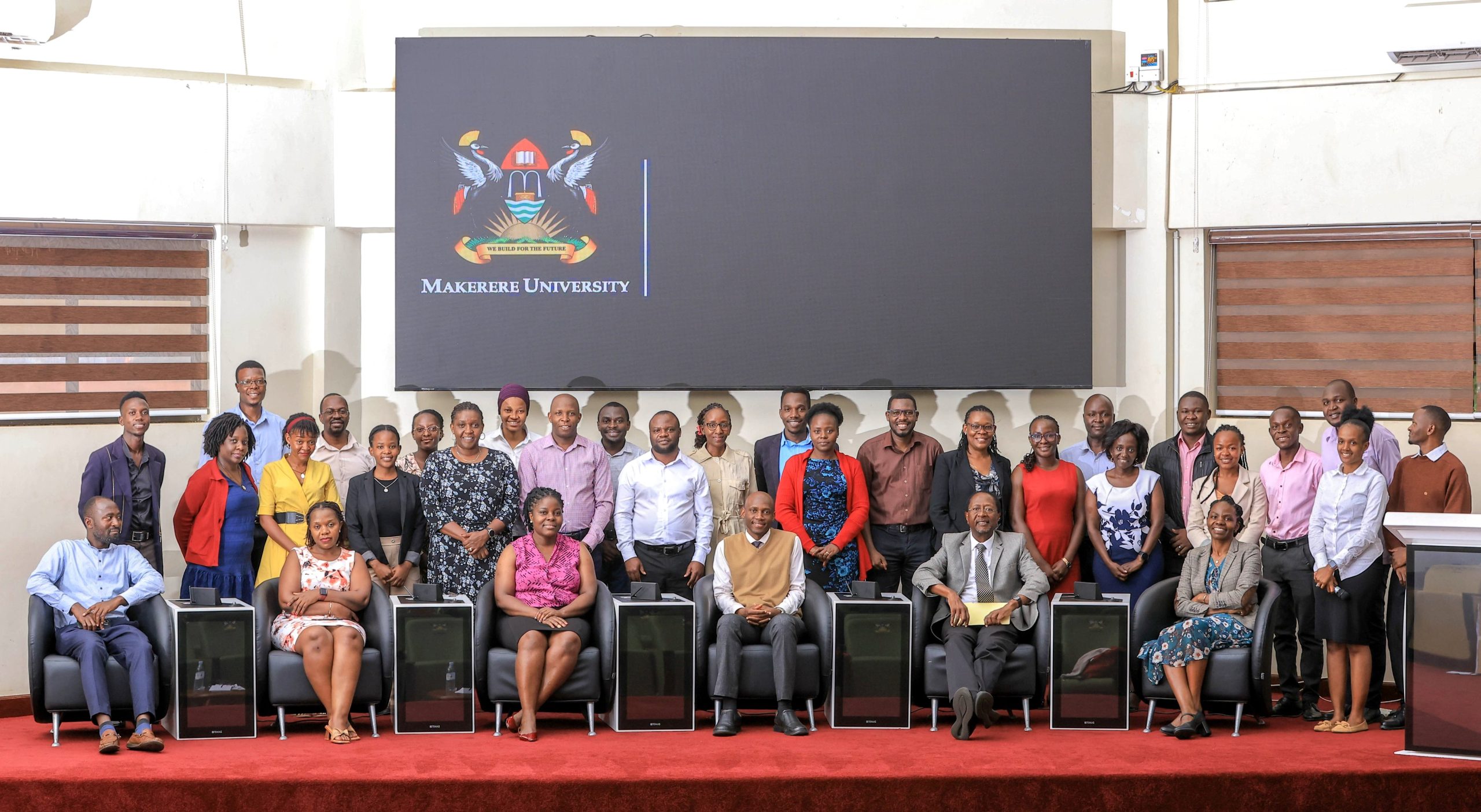 Seated: Prof. David Musoke Serwadda (2nd Right) and Assoc. Prof. David Musoke (3rd Right) with participants at the workshop on 20th August 2025. Workshop on Strengthening Equitable Partnerships in International Research Collaboration in Uganda, keynote address by Prof. David Musoke Serwadda,20th August 2025, Makerere University School of Public Health (MakSPH) Auditorium, Kampala Uganda, East Africa.